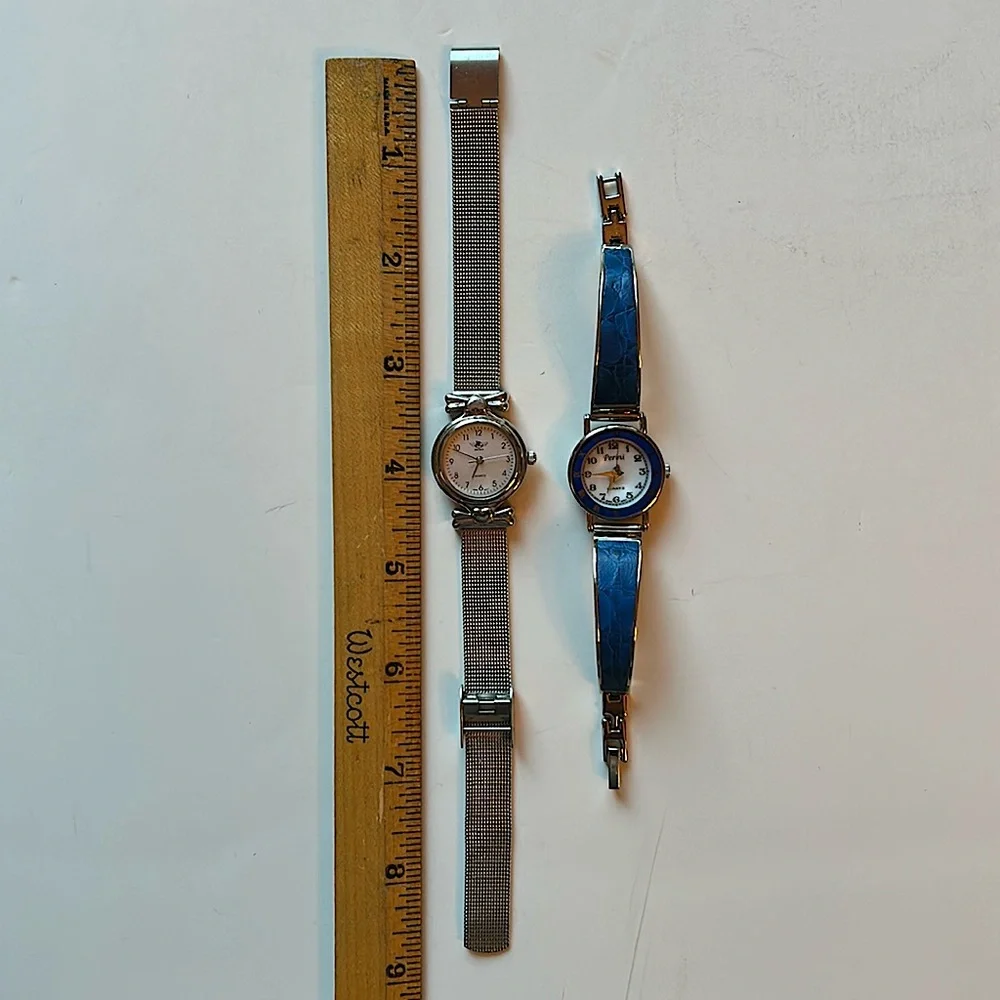 Two vintage quartz watches one stainless steel with hearts one with blue trim